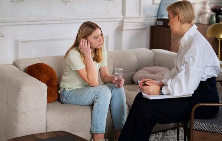 Therapist talking with a person about OCD care.